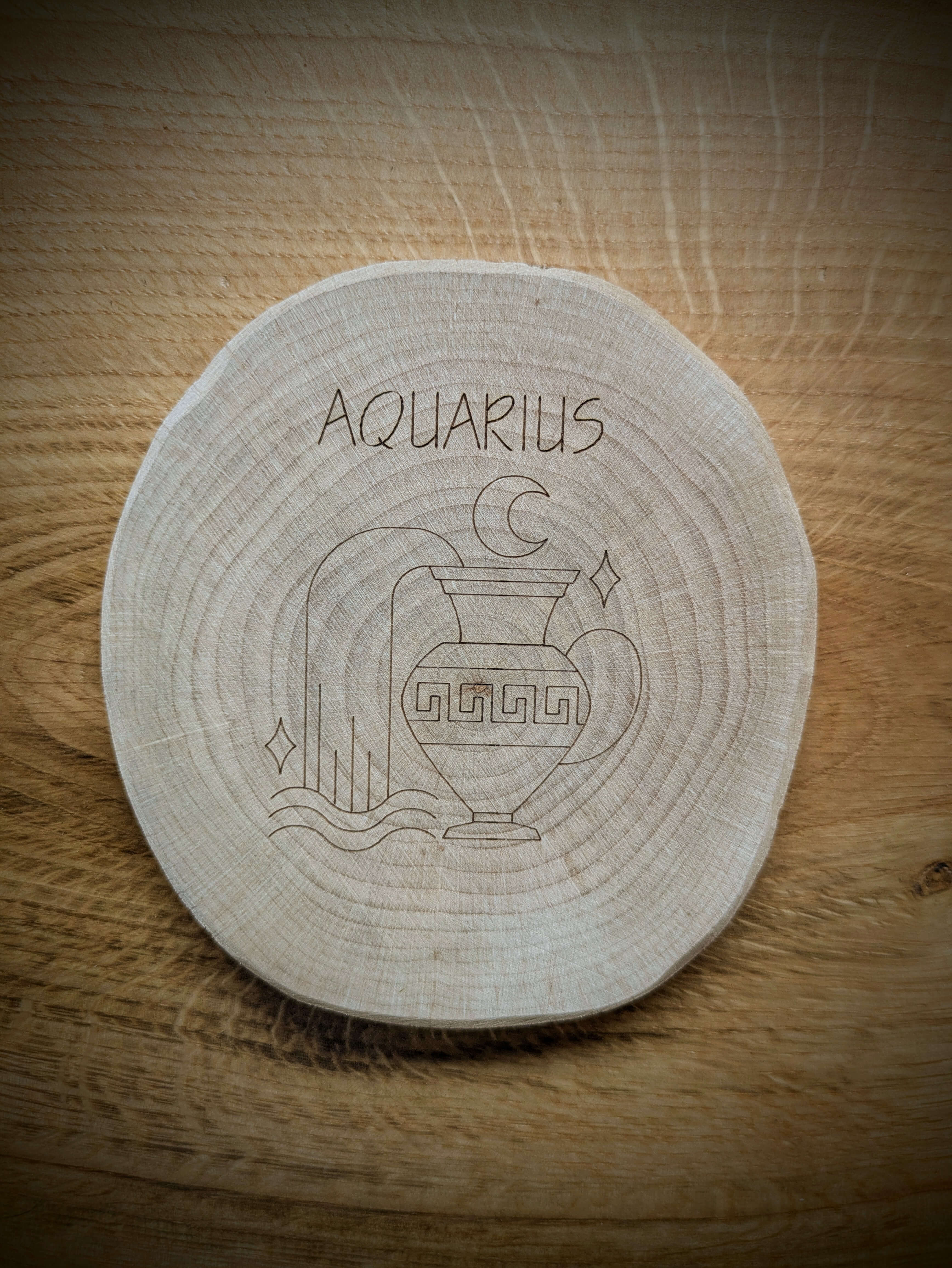 Aquarius Zodiac Kosmic Coaster on reclaimed Welsh timber