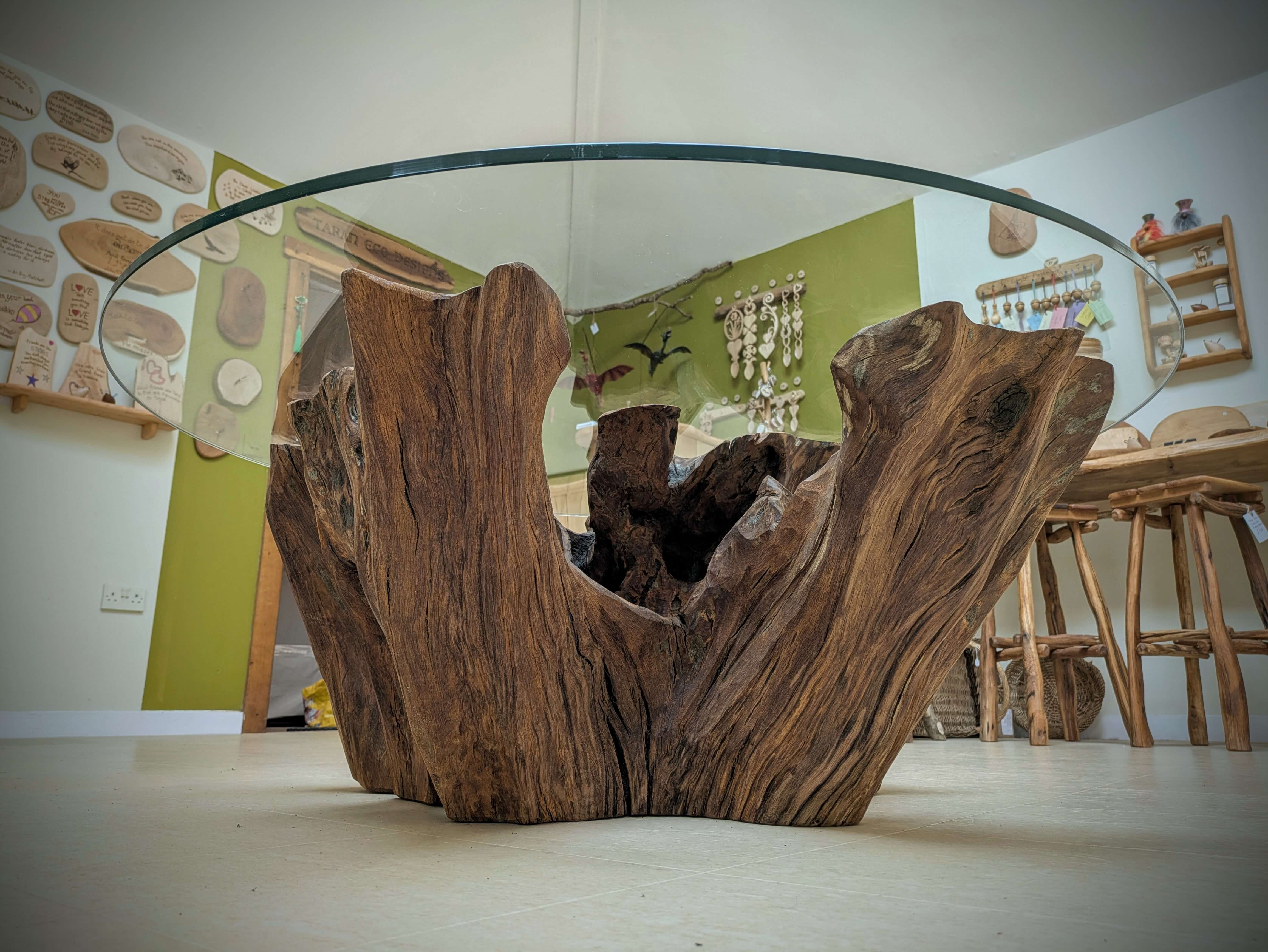 A reclaimed Oak Stump Table, with a glass top