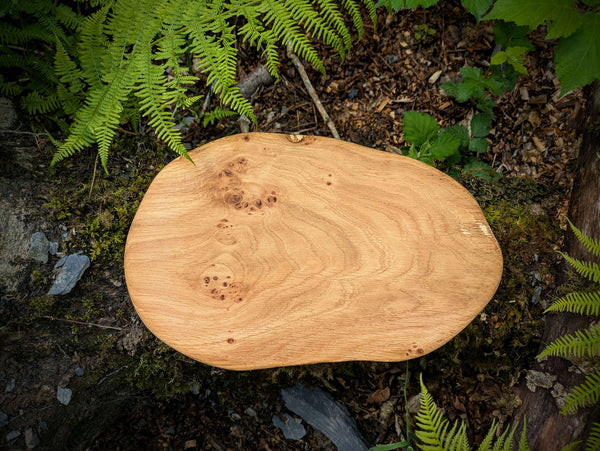 A handmade wooden chopping board made with reclaimed Welsh timber