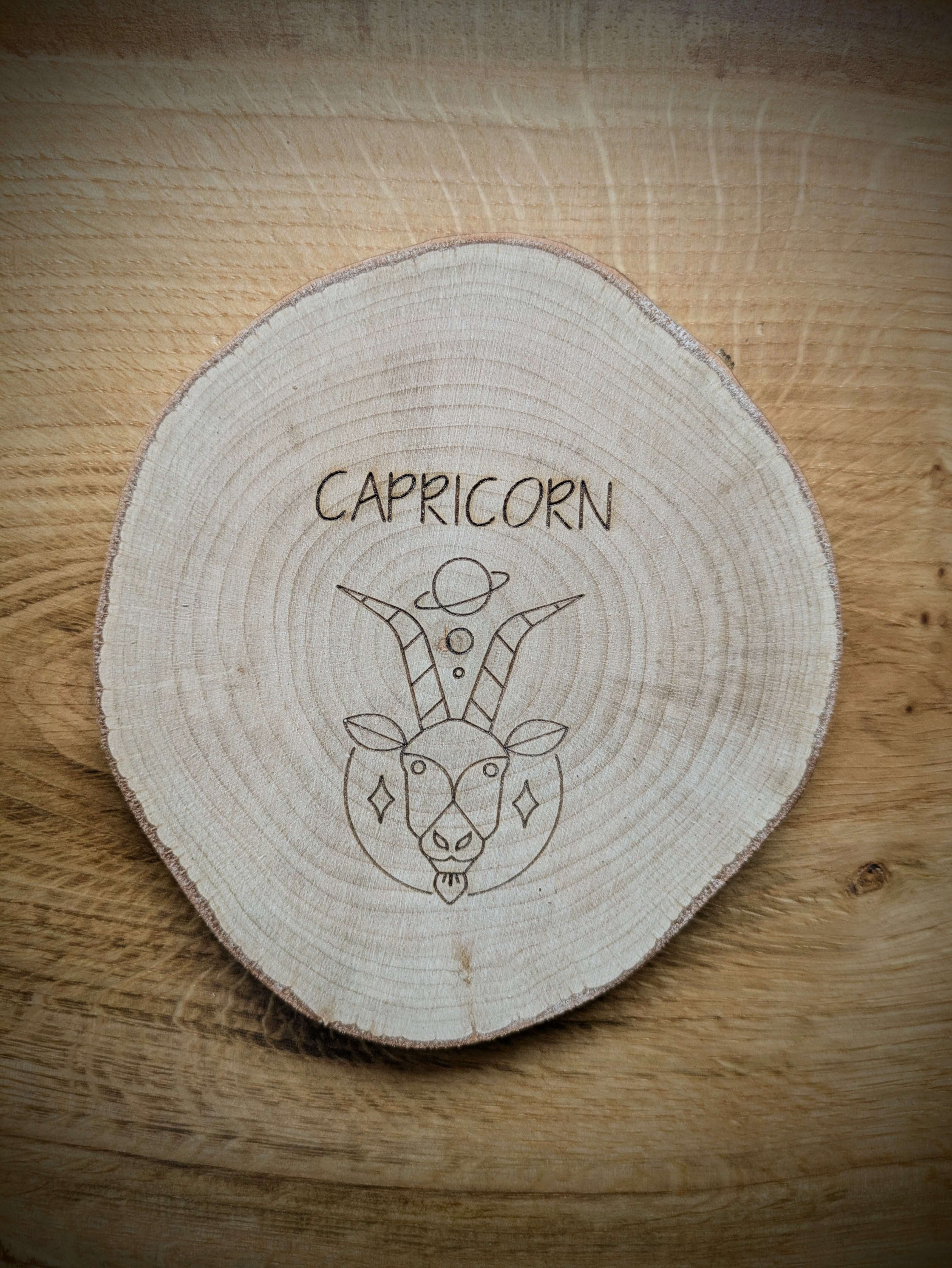Capricorn Zodiac Kosmic Coaster on reclaimed Welsh timber