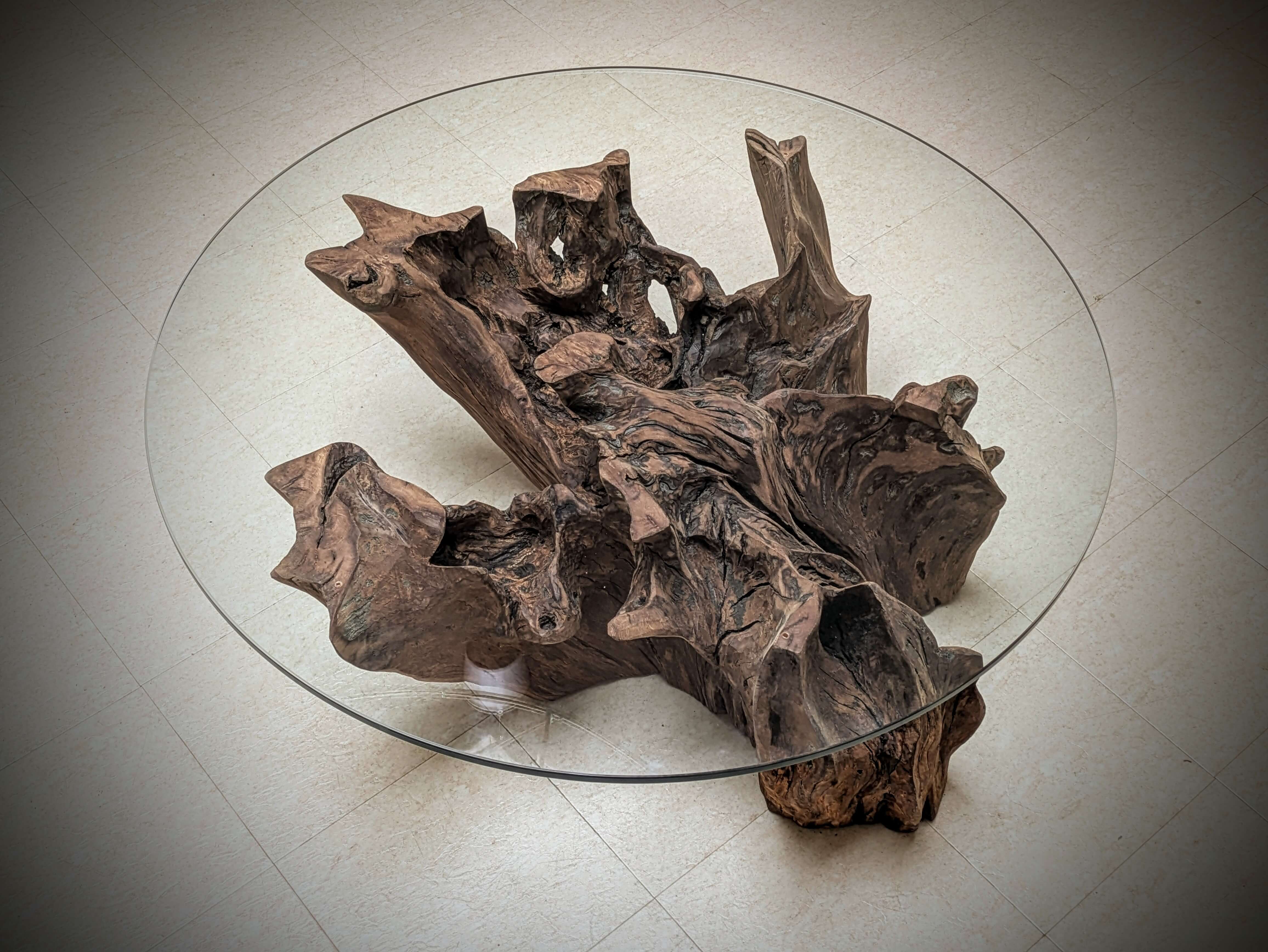 A reclaimed Oak Stump Table, with a glass top 