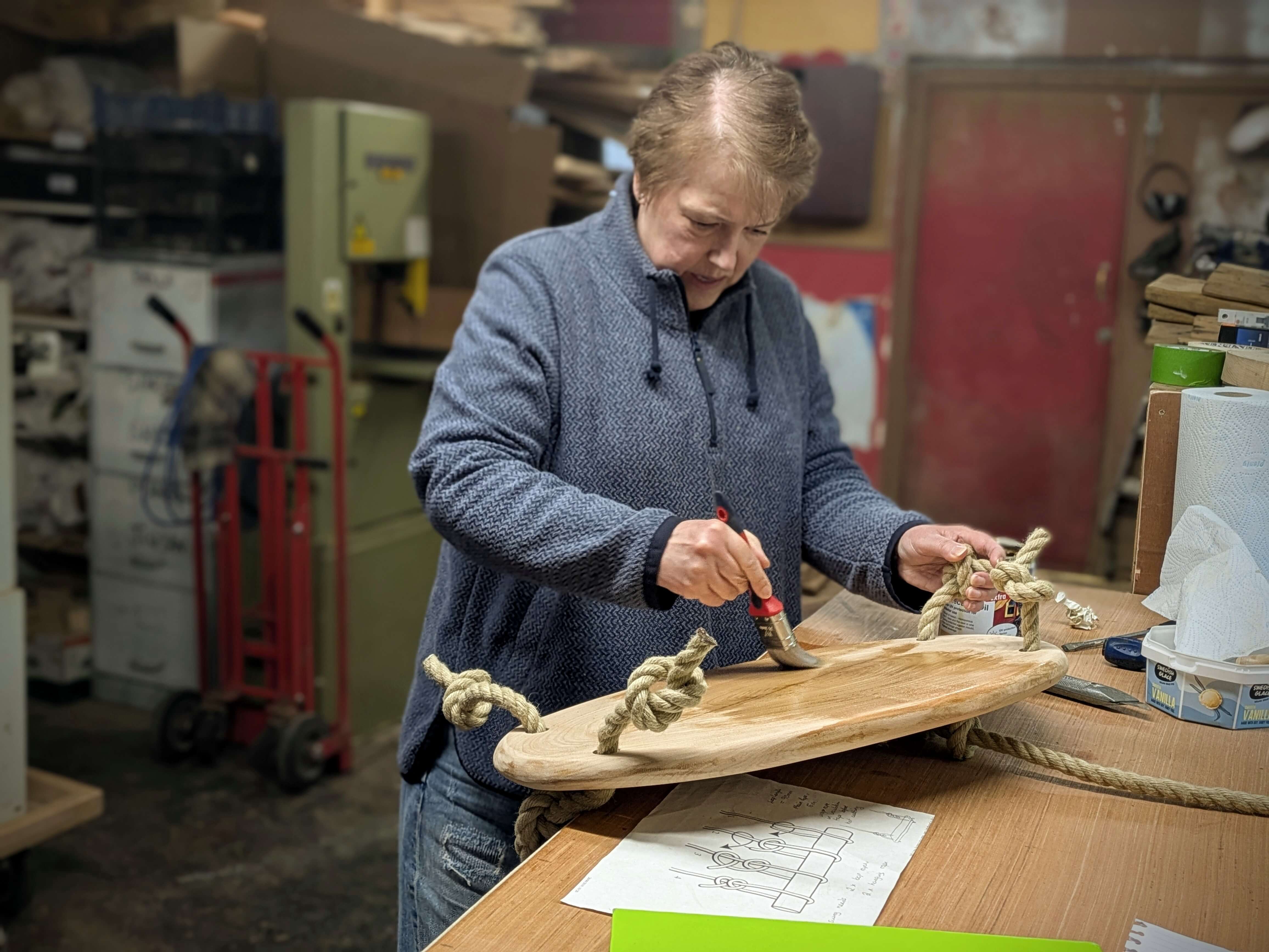 Someone taking part in a make a swing woodworking course