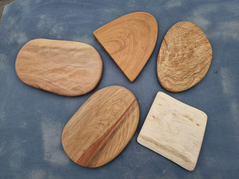A group of chopping boards made by students on a Taran Eco Designs woodworking course